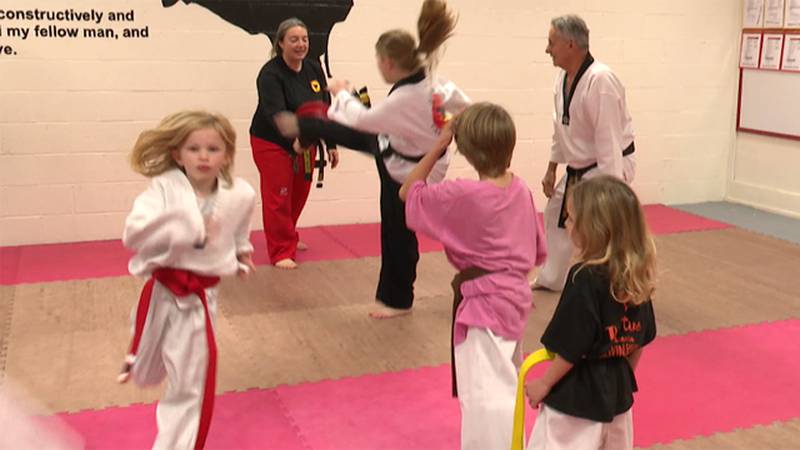 Members of Sunset Taekwondo continue their decade-long tradition of breaking boards to raise...