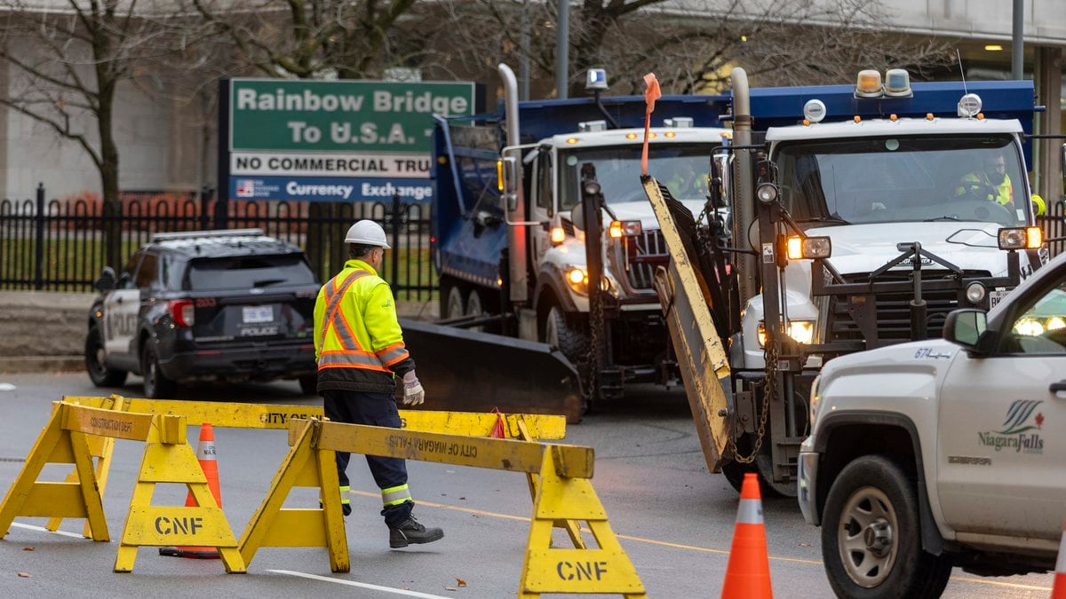 Trucks are positioned to block the entrance to the Rainbow Bridge border crossing between the...