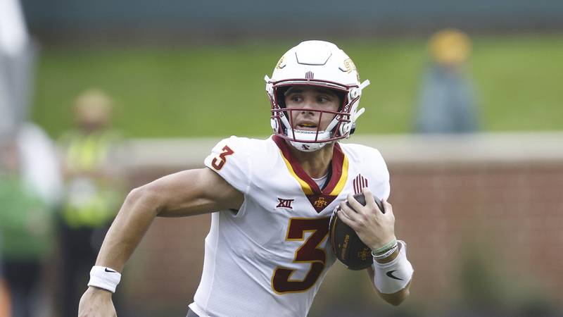 Iowa State quarterback Rocco Becht (3) carries the ball during an NCAA football game against...